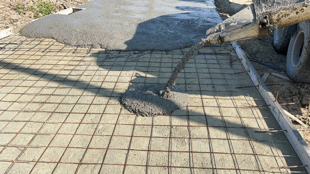 Ready-mix concrete poured over rebar mesh